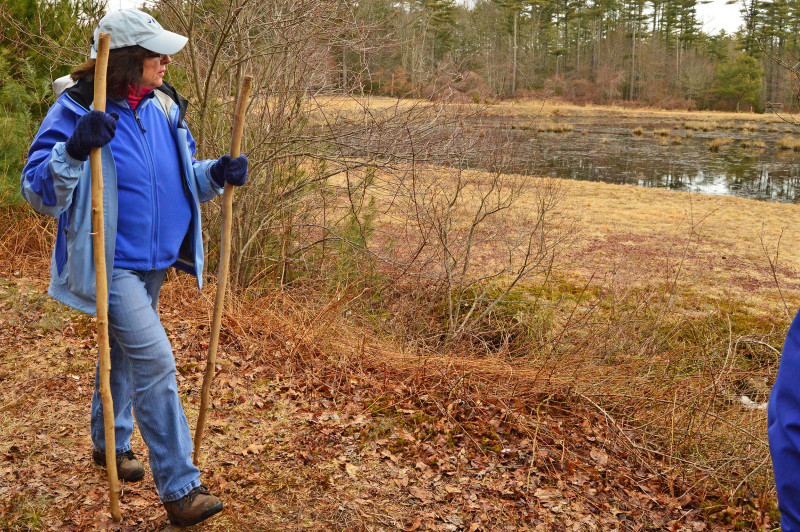 a woman walking on a trail in Wareham
