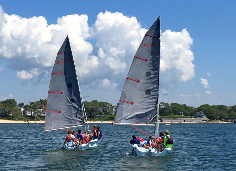 Two sailboats in Onset Bay at a Buzzards Bay Coalition program