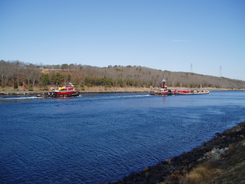 tug escorting an oil barge through Cape Cod Canal