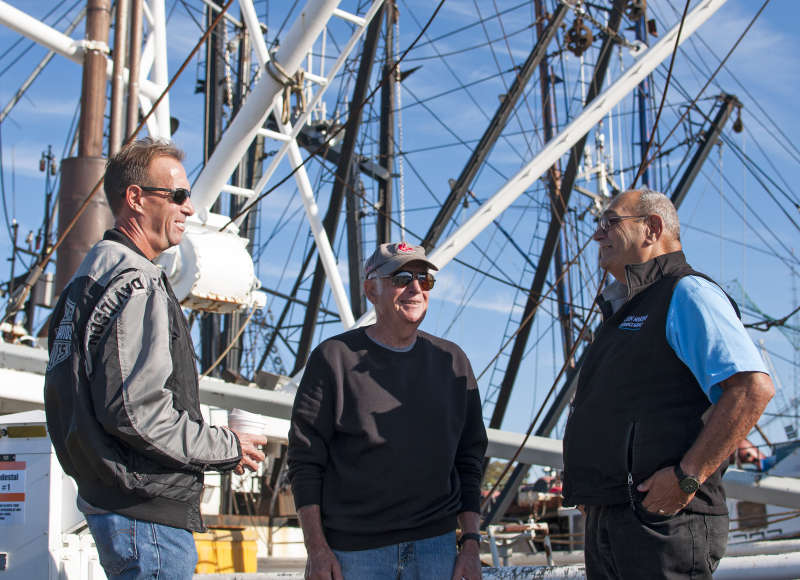 Rodney Avila with commercial fishermen on New Bedford Harbor