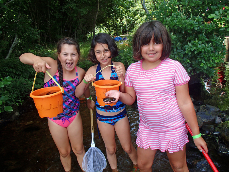 three girls with beach pails