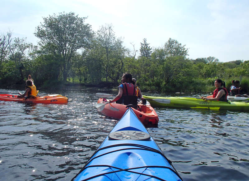 girls in kayaks on the Westport River