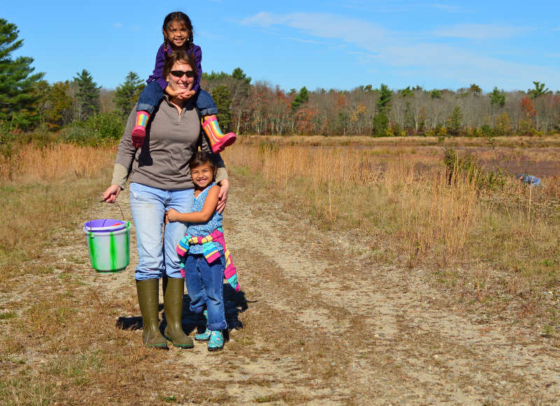 a mother with two daughters on the trail at The Bogs