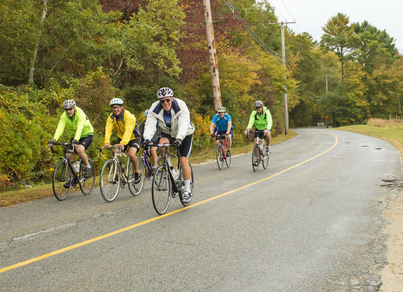 a group of men bicycling on a road in Mattapoisett