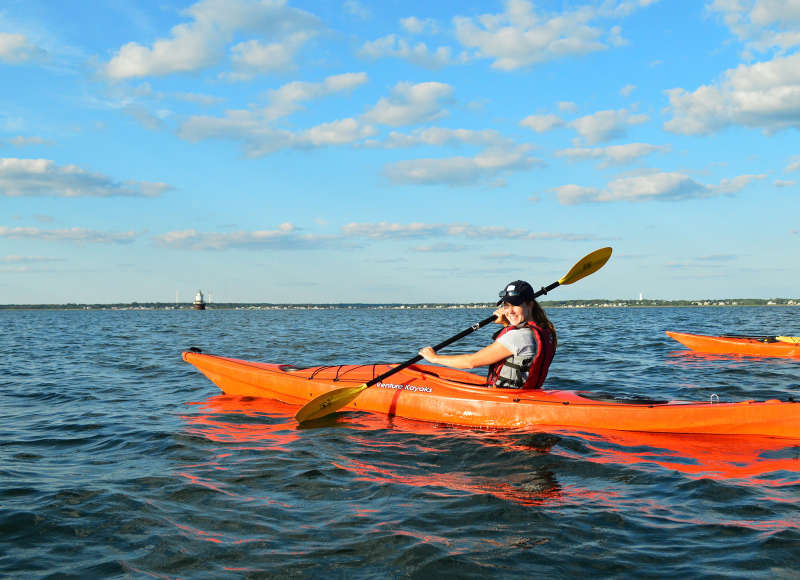 woman kayaking in New Bedford Harbor
