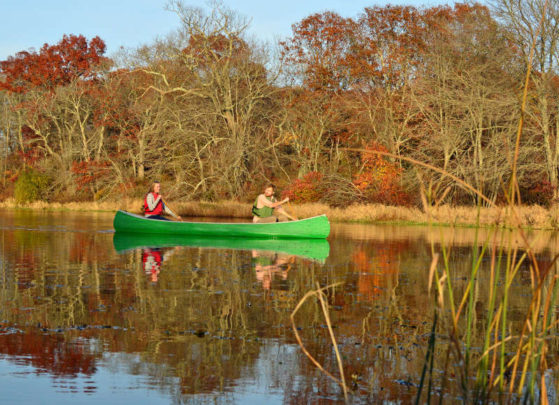 two people canoeing on the Acushnet River
