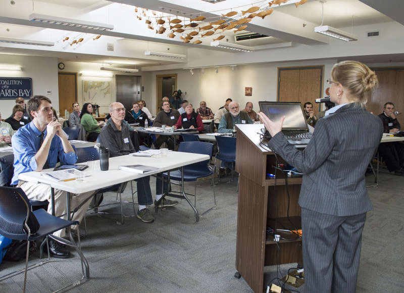 speaker giving a presentation at the Buzzards Bay Center in New Bedford