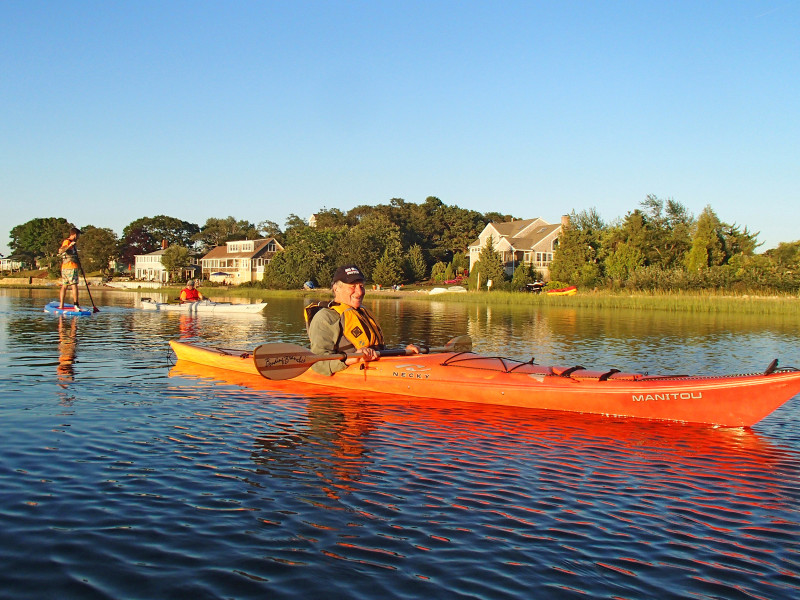 a Buzzards Bay Coalition member kayaks in Onset Bay