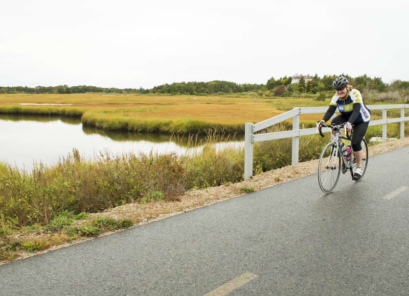 Buzzards Bay Watershed Ride cyclist on Shining Sea Bikeway in Falmouth