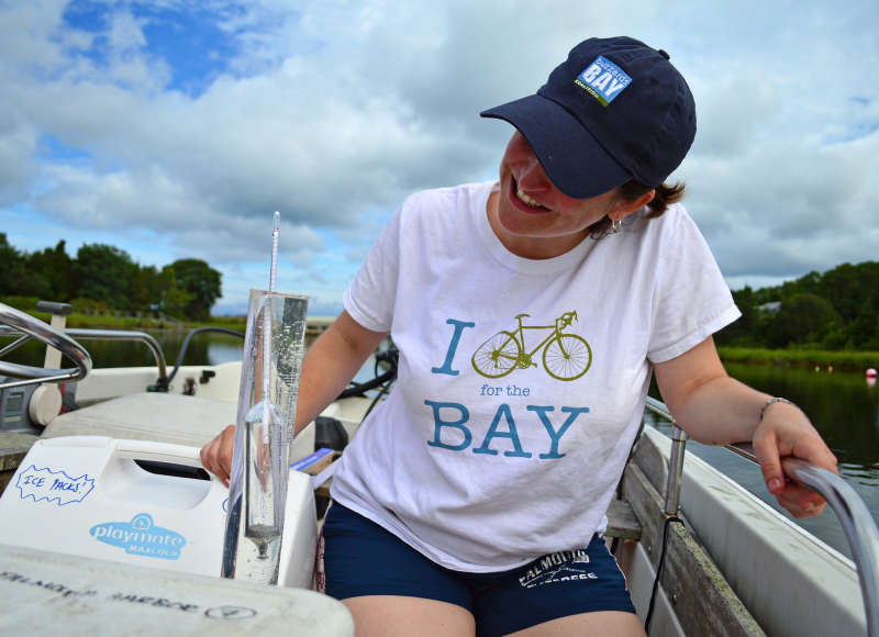 Buzzards Bay Coalition staff member Rachel Jakuba taking water samples in West Falmouth Harbor