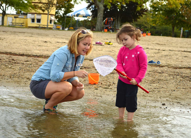 Woman and child on beach at Apponagansett Park