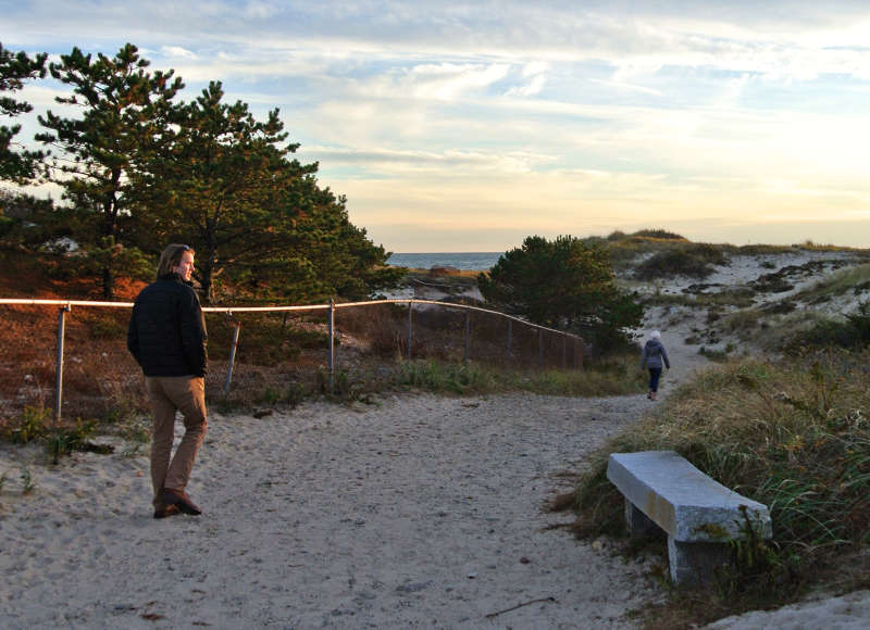 people walk toward Cherry & Webb Beach in Westport