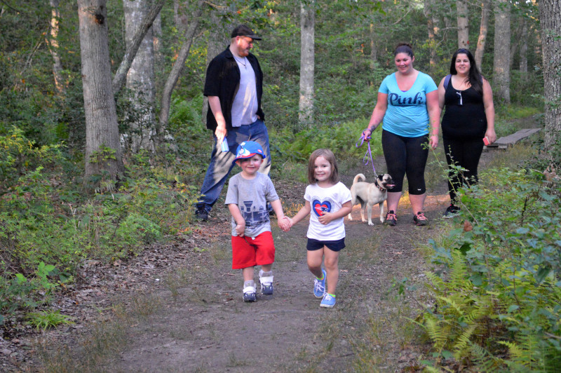 family on trail at Cornell Farm