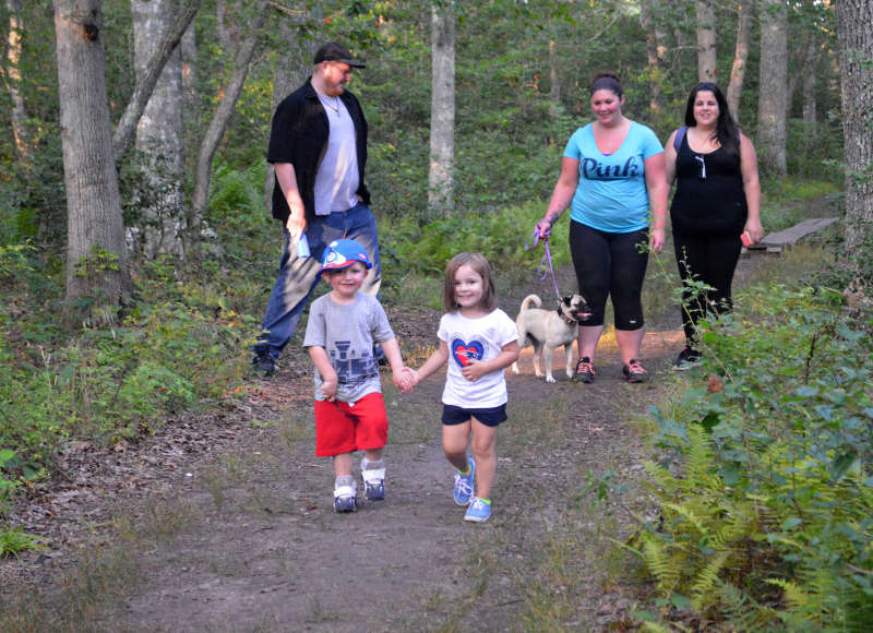 family on trail at Cornell Farm