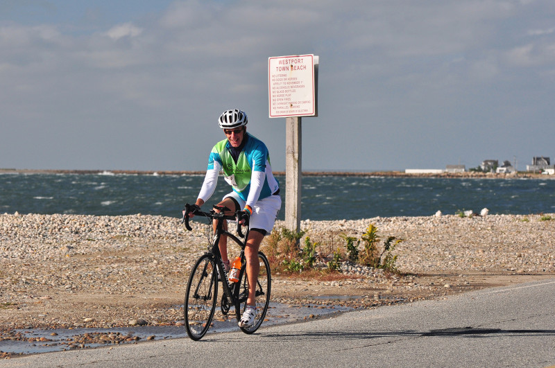 bicyclist riding past East Beach in Westport during the Buzzards Bay Watershed Ride