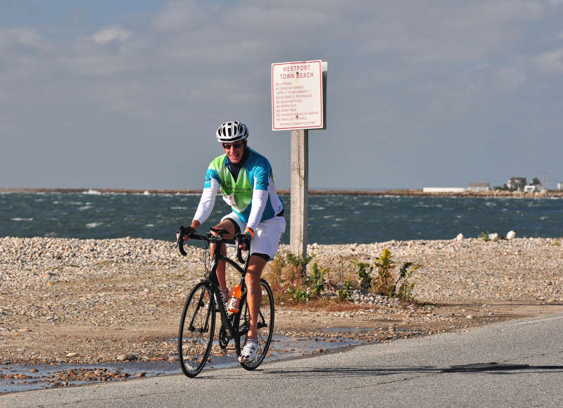 bicyclist riding past East Beach in Westport during the Buzzards Bay Watershed Ride