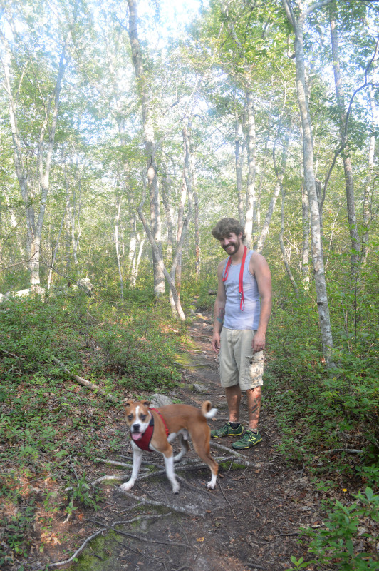 a man and his dog on the trails at Frank Knowles Little River Reserve in Dartmouth