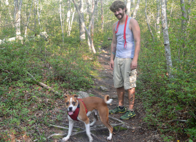 a man and his dog on the trails at Frank Knowles Little River Reserve in Dartmouth