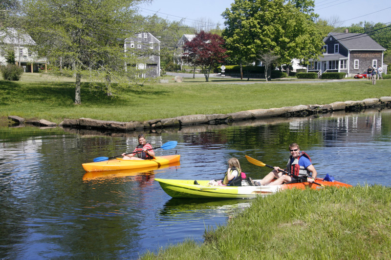 three people in kayaks on the East Branch of the Westport River at the Head of Westport Town Landing