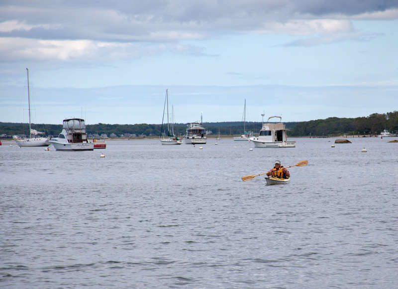 an old man kayaking in Onset Bay