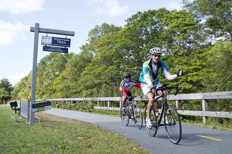 two cyclists riding on the Phoenix Bike Trail in Fairhaven during the Buzzards Bay Watershed Ride