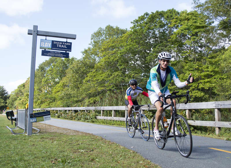 two cyclists riding on the Phoenix Bike Trail in Fairhaven during the Buzzards Bay Watershed Ride