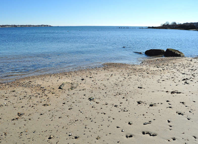 sandy beach on Clarks Cove at Roger Street boat ramp