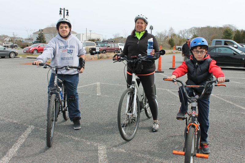 a grandmother and two boys on bikes at Buzzards Bay Recreation Area in Bourne