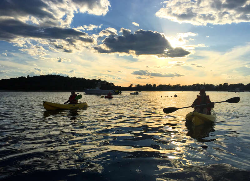 kayakers in Onset Bay at sunset