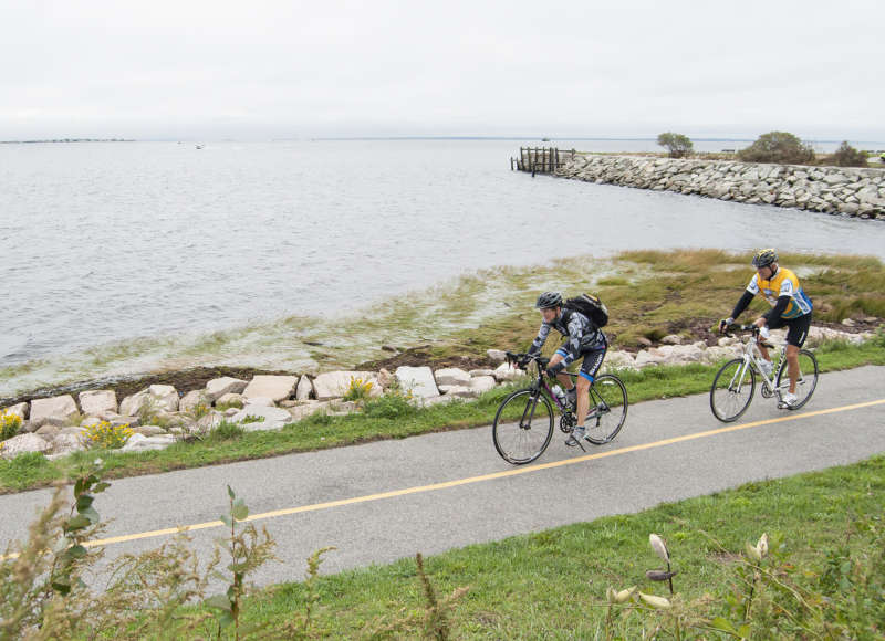 two bicyclists cruise through New Bedford during the Buzzards Bay Watershed Ride