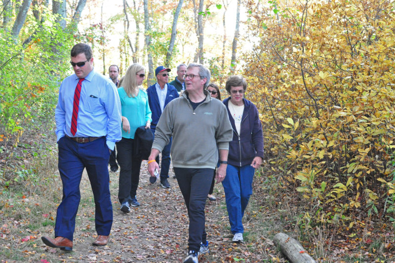 a group of people walking on the trail at The Sawmill in Acushnet