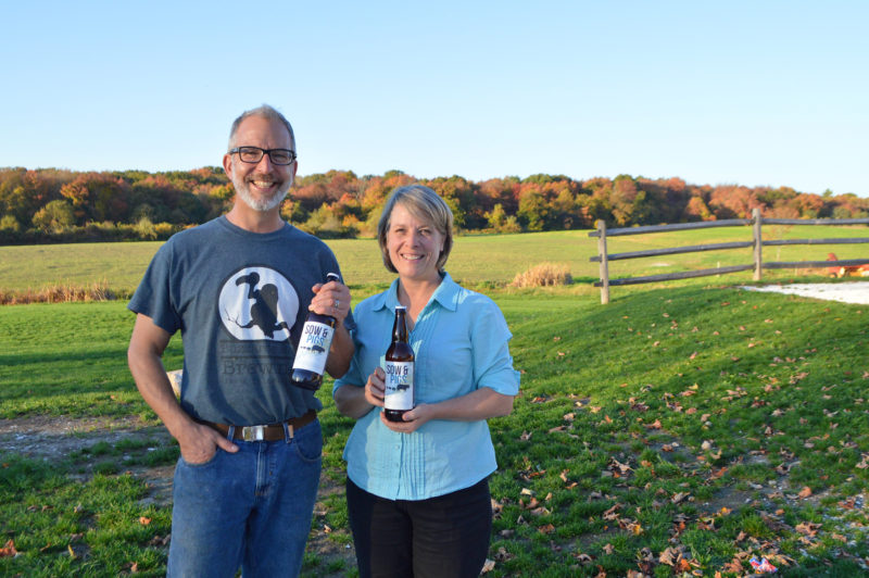 owner of Buzzards Bay Brewing with Buzzards Bay Coalition Sow & Pigs beer