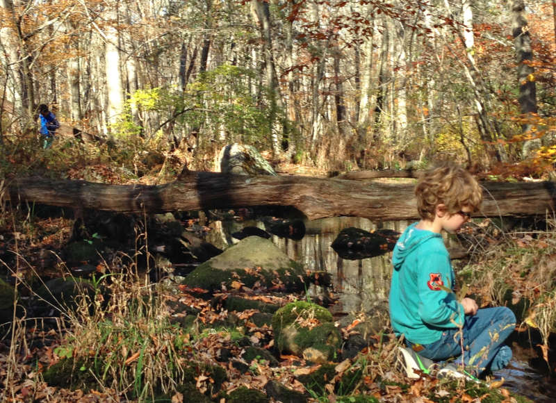 child playing by Angeline Brook in Westport