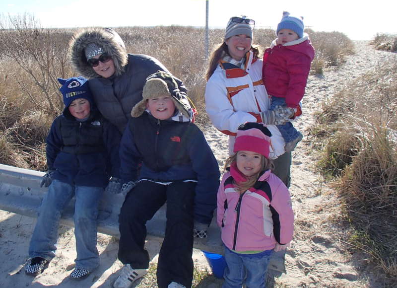 two families at the beach in winter at West Island