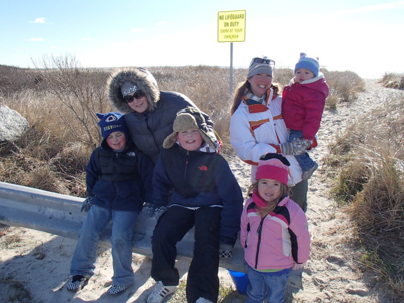 two families at the beach in winter at West Island