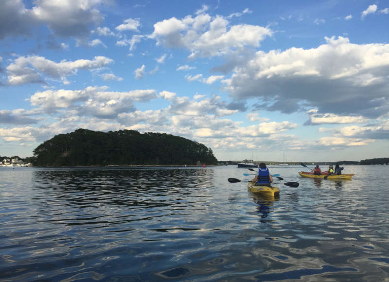 people kayaking in Onset Bay near Wickets Island