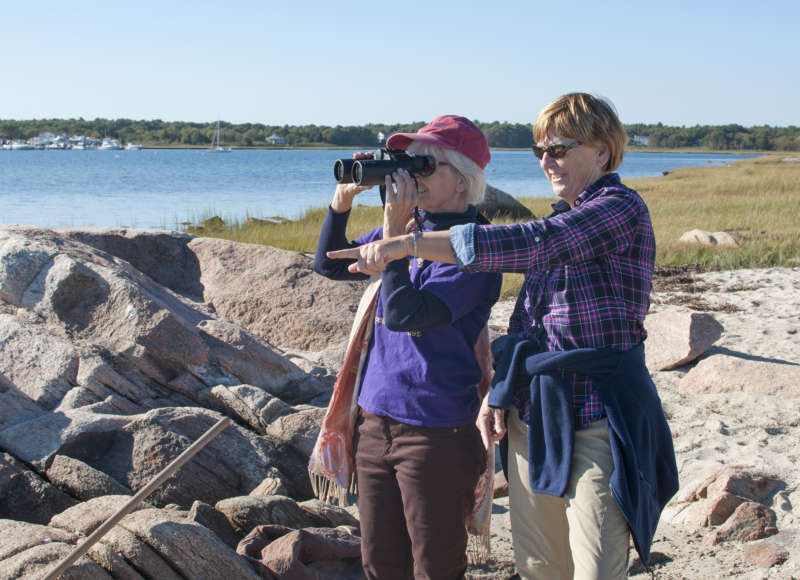 two women standing on the beach at the Munn Preserve in Mattapoisett