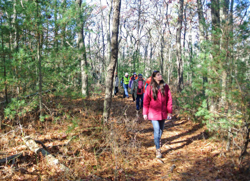 People walking on the trail through Little Bay and Monks Park in Bourne.