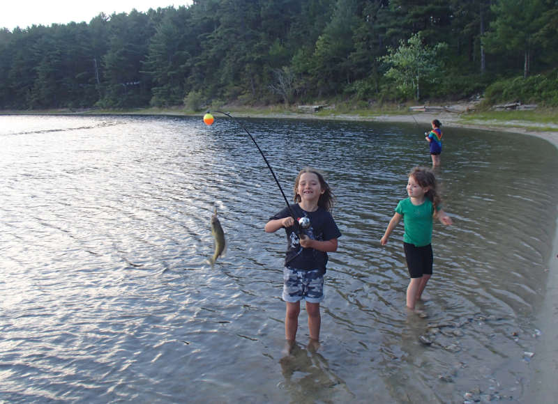 young girls fishing in Fearing Pond at Myles Standish State Forest