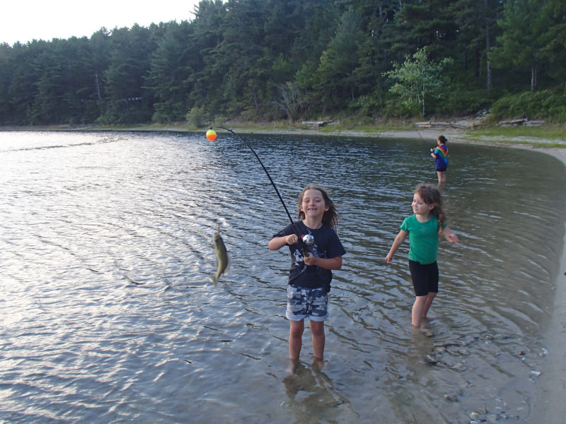 young girls fishing in Fearing Pond at Myles Standish State Forest