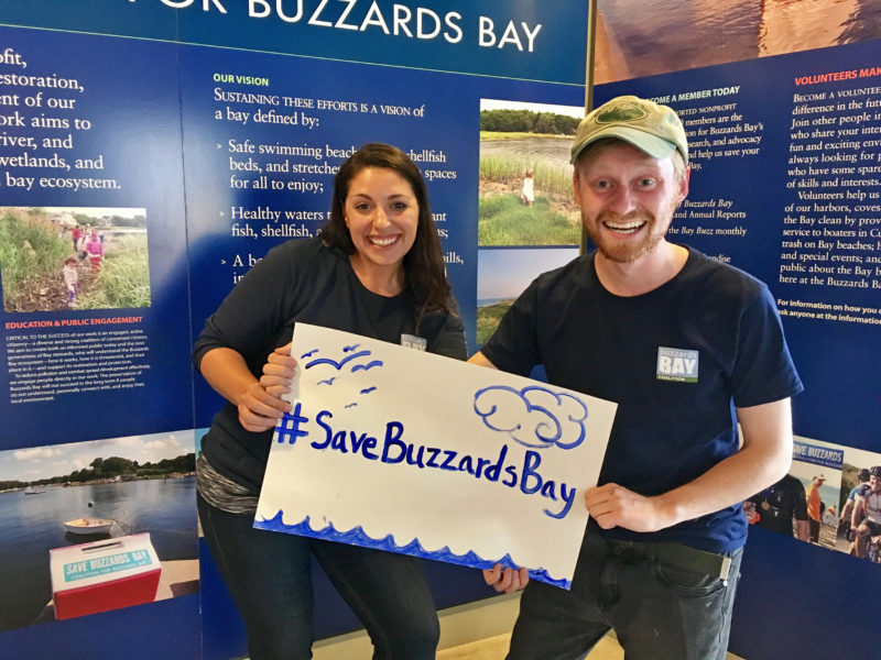 two people holding a Save Buzzards Bay March for Science sign