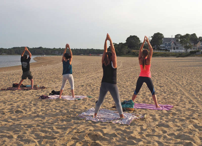 people doing yoga on Shell Point Beach in Wareham
