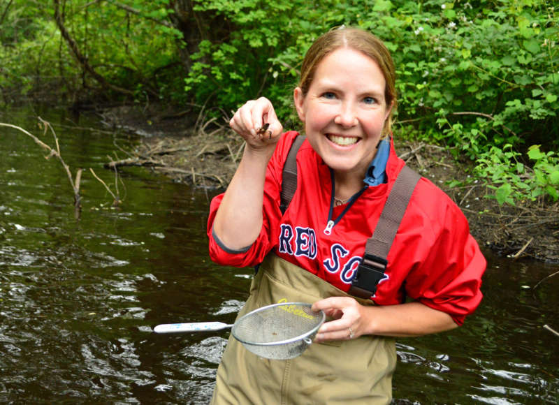 woman holding a crayfish from the Acushnet River at LaPalme Farm