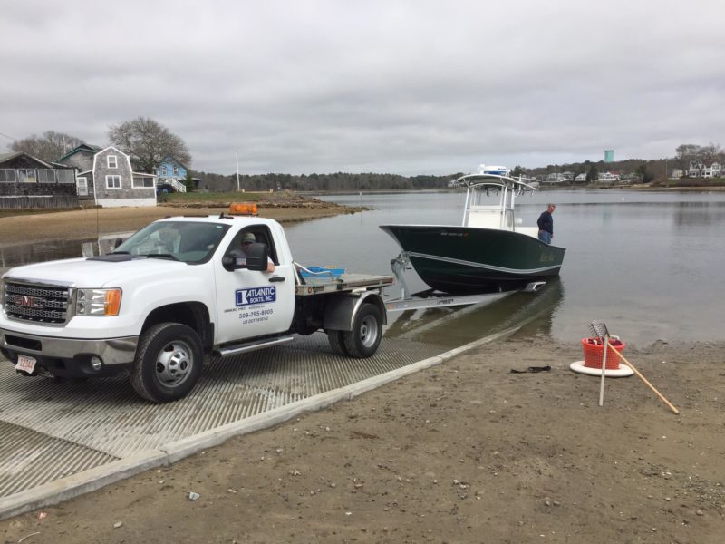 people launching a boat into Broad Cove from the Onset boat ramp in Wareham