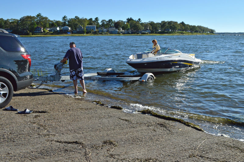 boaters putting boat on trailer at Tempest Knob ramp in Wareham