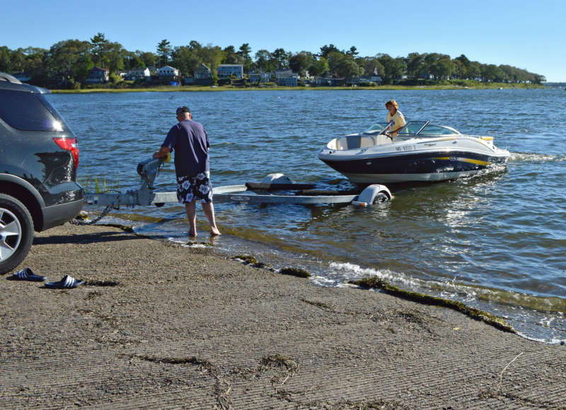 boaters putting boat on trailer at Tempest Knob ramp in Wareham