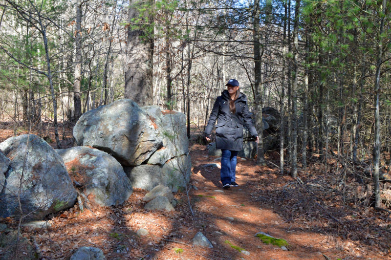 woman walking on a trail at the Watuppa Reservation in Fall River