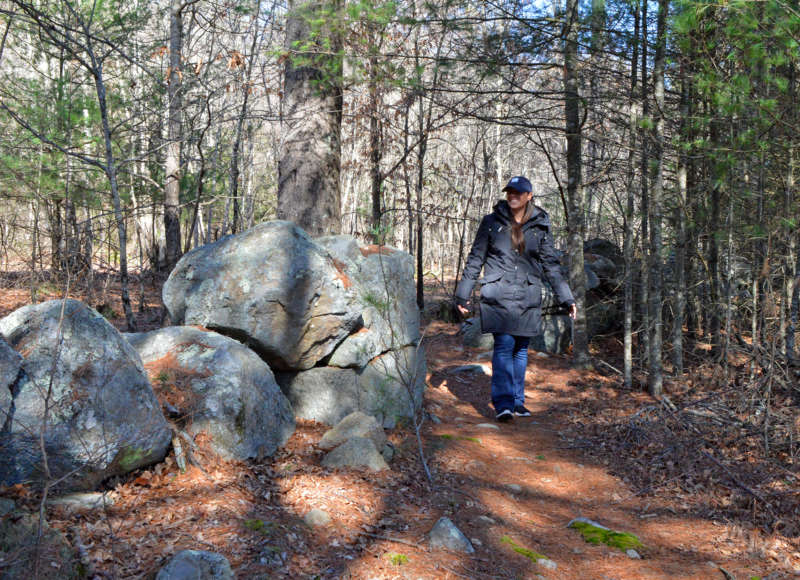 woman walking on a trail at the Watuppa Reservation in Fall River