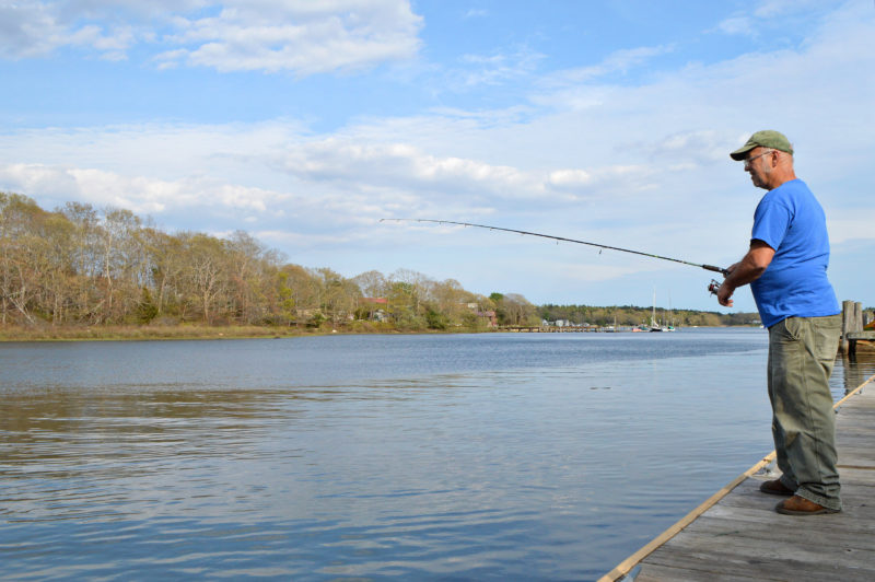 man fishing from sport fishing pier at Besse Park in Wareham