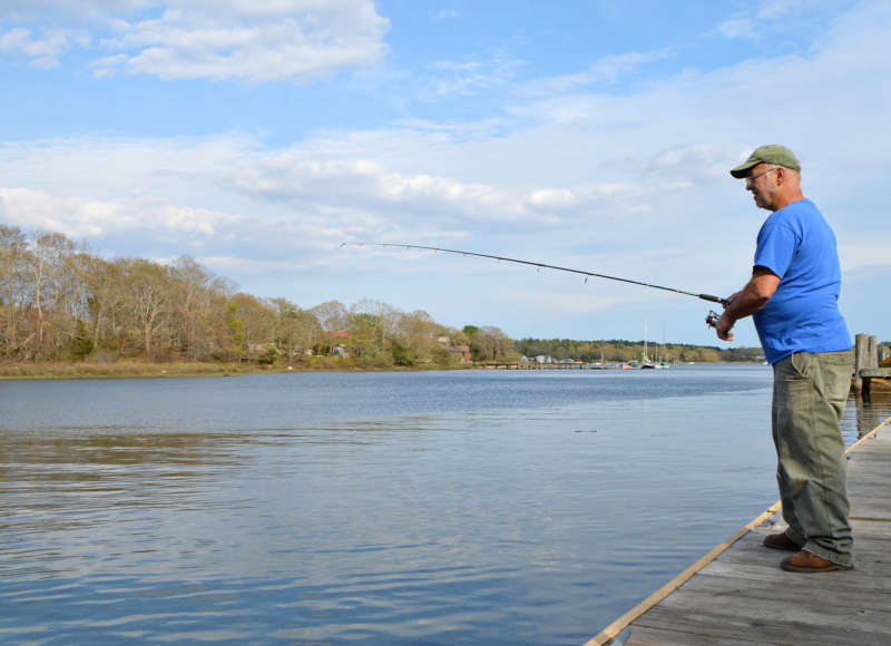 man fishing from sport fishing pier at Besse Park in Wareham